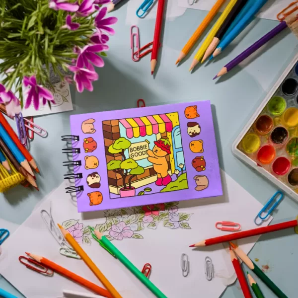 Mini-Livro-de-Colorir-Bobby-Goods-lilas-Edi-o-de-Bolso-1-1.png
